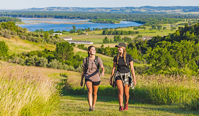Two girls hiking in Fort Abraham Lincoln State Park