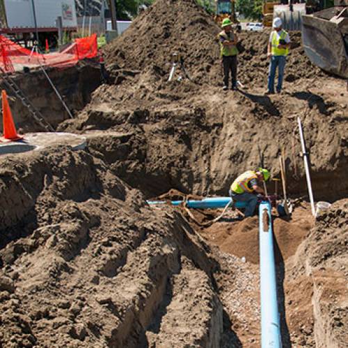Water pipes being installed in a Minot construction project