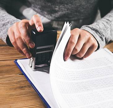 Person stamping forms