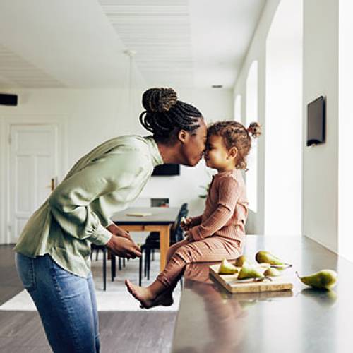 Woman and daughter inside home