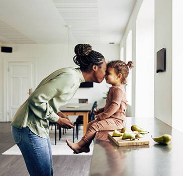 Woman and daughter inside home