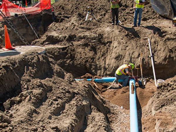 Water pipes being installed in a Minot construction project