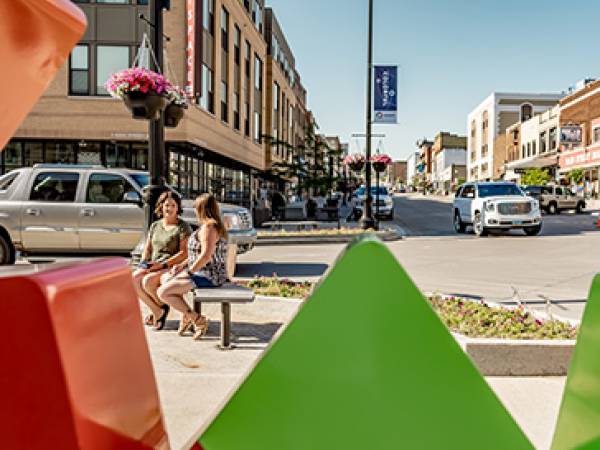 Downtown Minot, looking through the new Minot logo sculpture