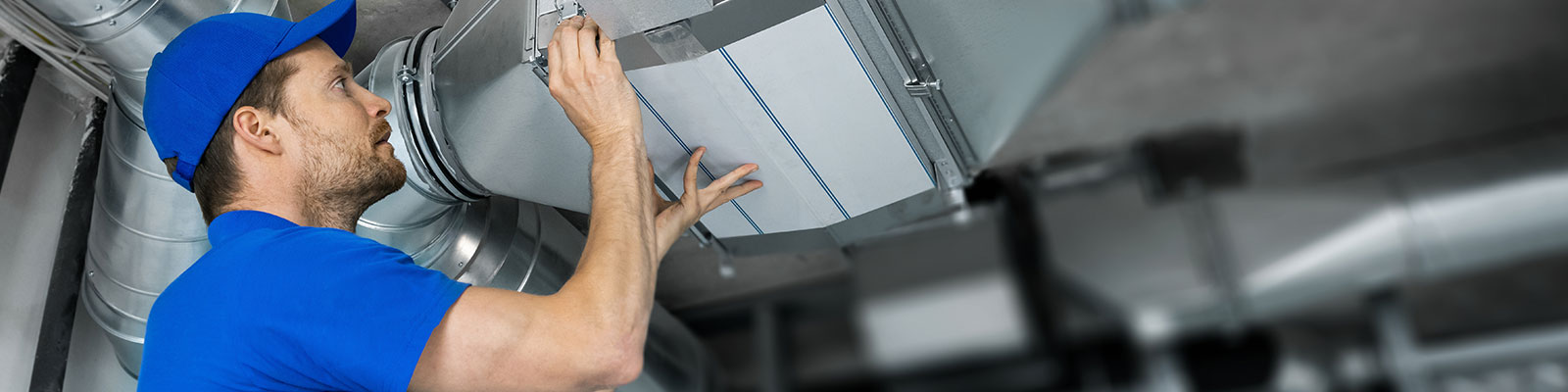 Man repairs HVAC system