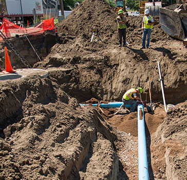 Water pipes being installed in a Minot construction project