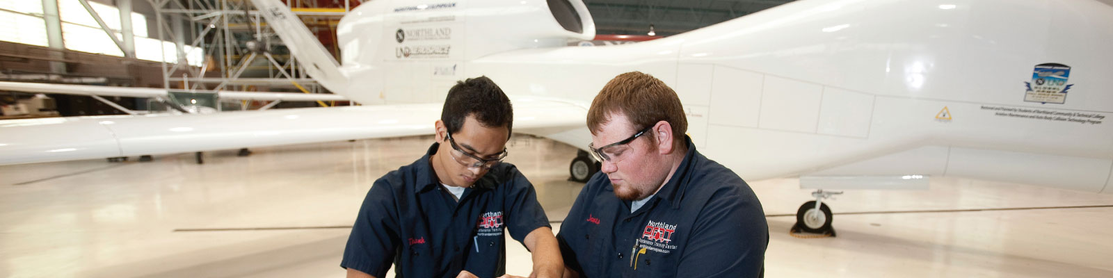 Northland mechanics working on a UAS engine