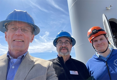 Kevin Iverson and others by wind farm