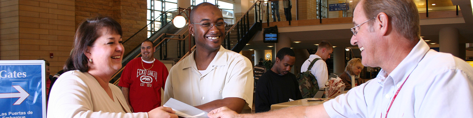 People buying tickets in the Grand Forks airport