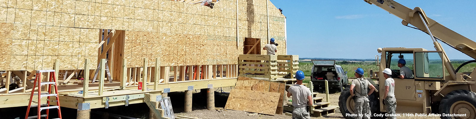 Soldiers construct a building 