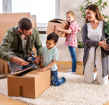 Family packs boxes to move
